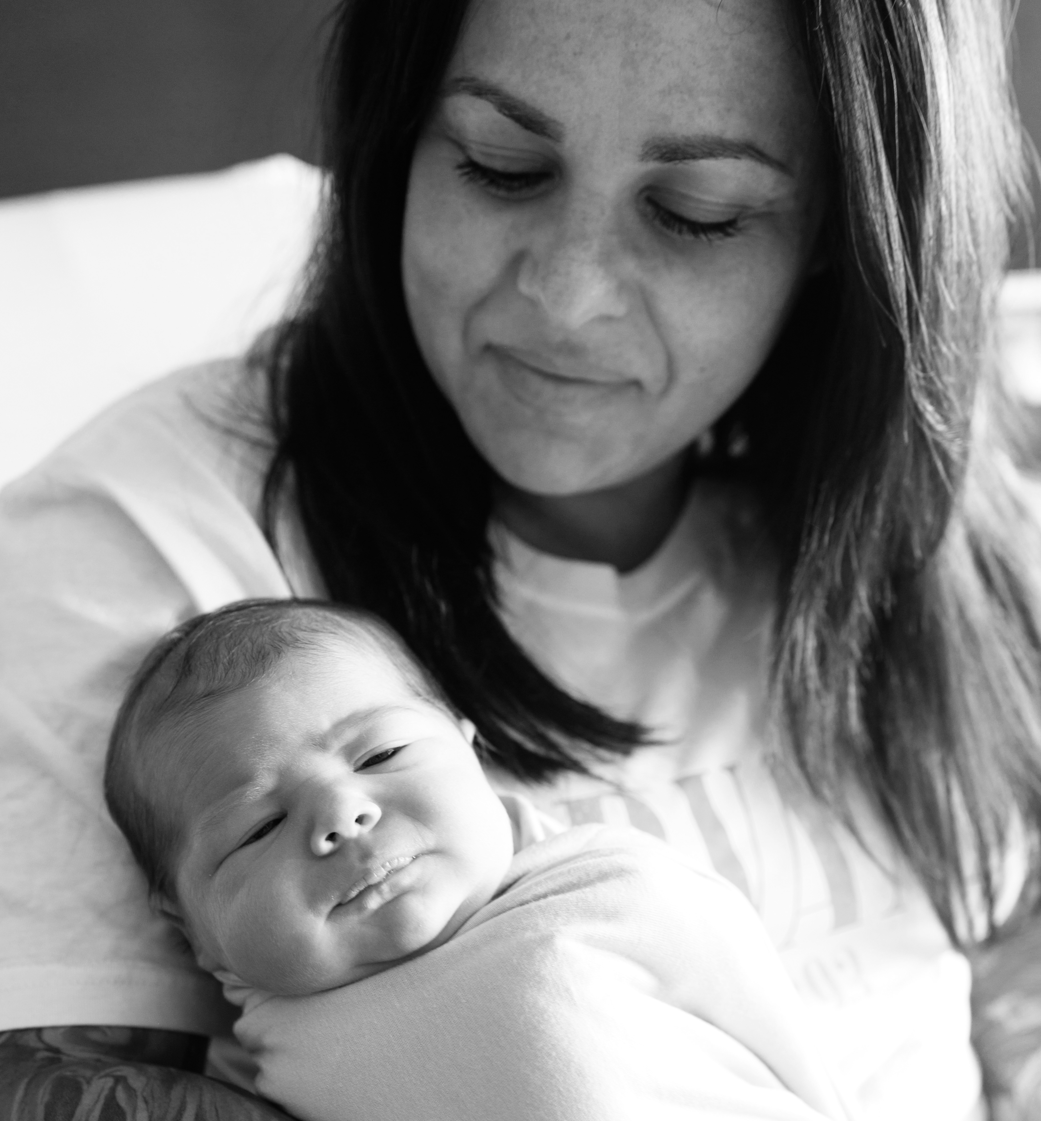 Courtney Orr holding her newborn baby in Kansas — a proud mom's tender moment